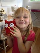 holding her owl made at the school holiday workshop at Frolic in Fabric
